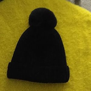 Black hat with pom pom